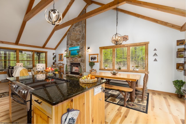 247 Daylily Ct, Terra Alta, WV 26764 - kitchen with stainless steel range with electric cooktop, a chandelier, high vaulted ceiling, beam ceiling, and healthy amount of natural light