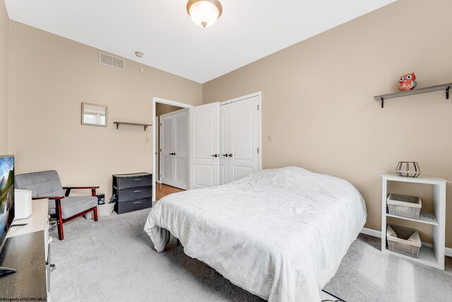 bedroom with a closet and baseboards