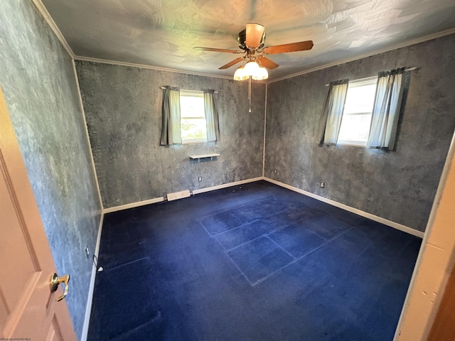 unfurnished room featuring plenty of natural light, a ceiling fan, and baseboards