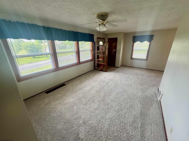 213 Albright Rd, Kingwood, WV 26537 - empty room featuring carpet flooring, ceiling fan, and a textured ceiling