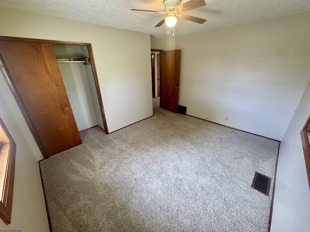 213 Albright Rd, Kingwood, WV 26537 - unfurnished bedroom with light colored carpet, a textured ceiling, a closet, and a ceiling fan