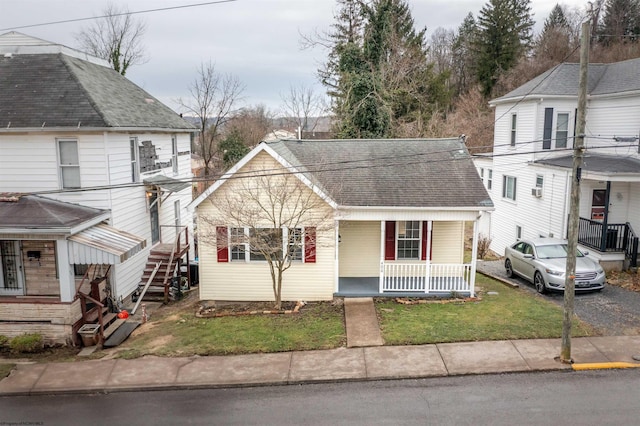 406 Maple Ave, Fairmont, WV 26554 - view of front of home featuring a porch, a front yard, and a shingled roof