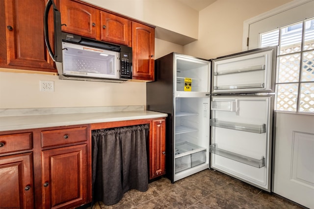 406 Maple Ave, Fairmont, WV 26554 - kitchen with light countertops, refrigerator, and dark tile patterned flooring