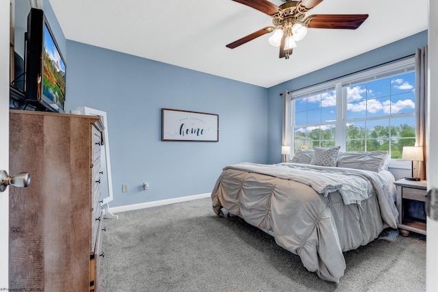 bedroom with carpet floors, baseboards, and ceiling fan