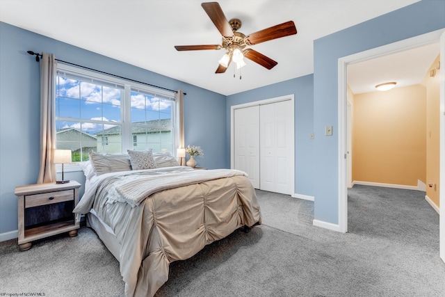 carpeted bedroom featuring baseboards, a closet, and ceiling fan