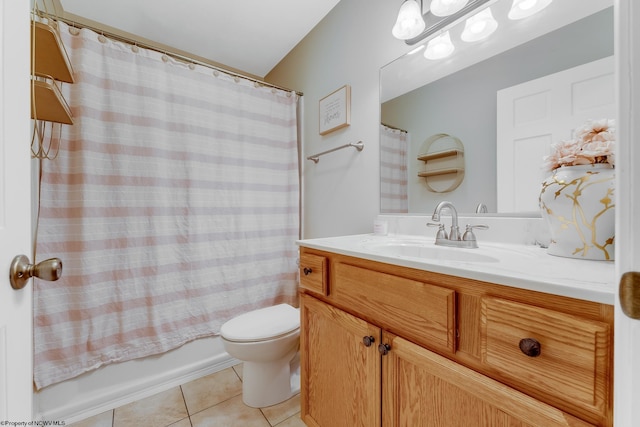 bathroom featuring tile patterned floors, toilet, vanity, and shower / tub combo with curtain