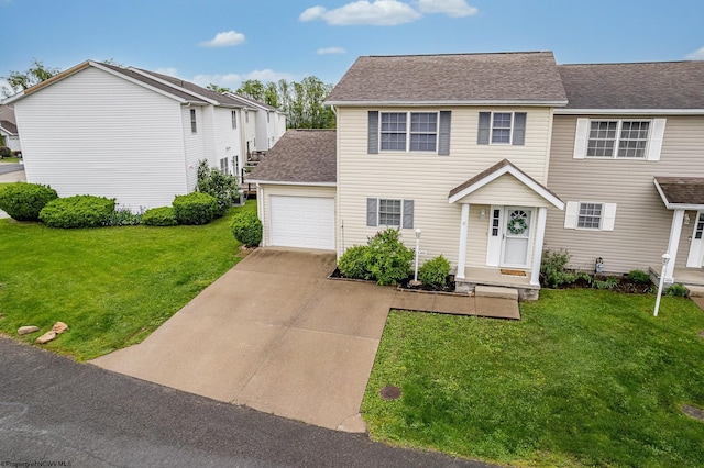 view of front of property with a garage, a front yard, concrete driveway, and a shingled roof