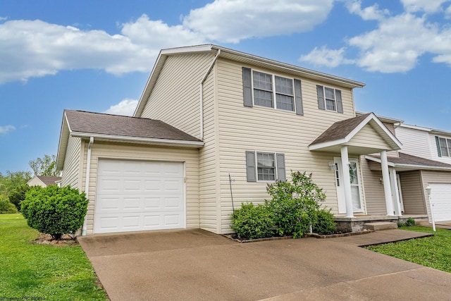 traditional-style home featuring driveway, a garage, a front lawn, and a shingled roof