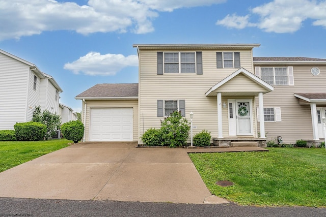 view of front of house featuring a garage, a front lawn, and driveway