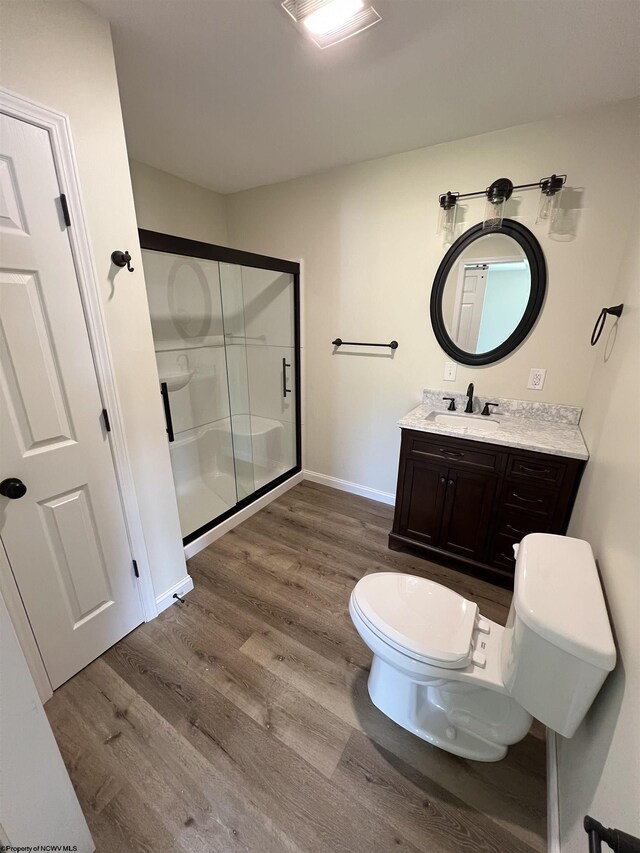 107 Valley Ct, Elkins, WV 26241 - full bath featuring toilet, wood finished floors, a stall shower, vanity, and baseboards