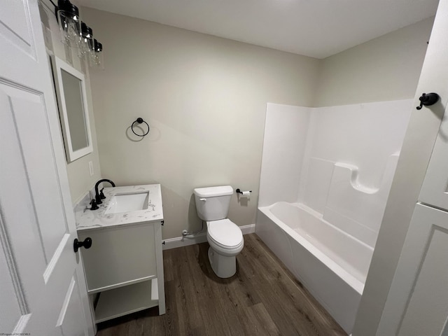 107 Valley Ct, Elkins, WV 26241 - bathroom with vanity, wood finished floors, toilet, baseboards, and bathtub / shower combination