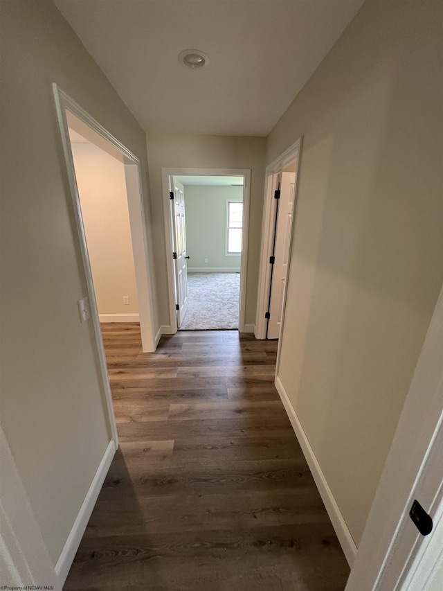 107 Valley Ct, Elkins, WV 26241 - hallway with baseboards and dark wood-type flooring