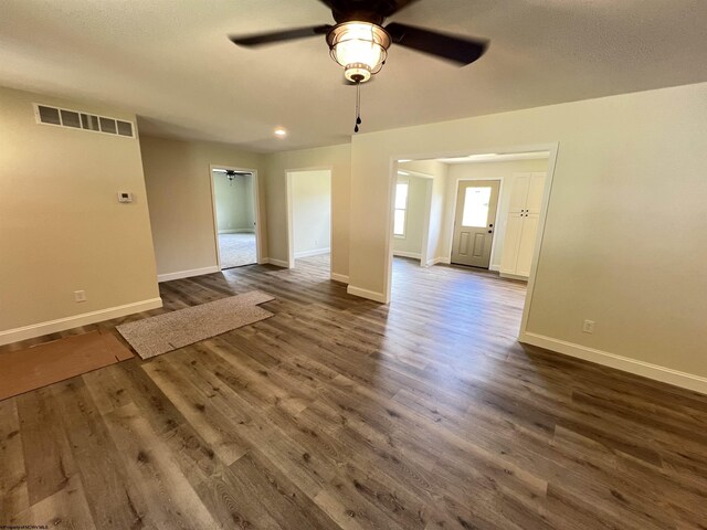 107 Valley Ct, Elkins, WV 26241 - unfurnished living room featuring ceiling fan, baseboards, dark wood-type flooring, and recessed lighting