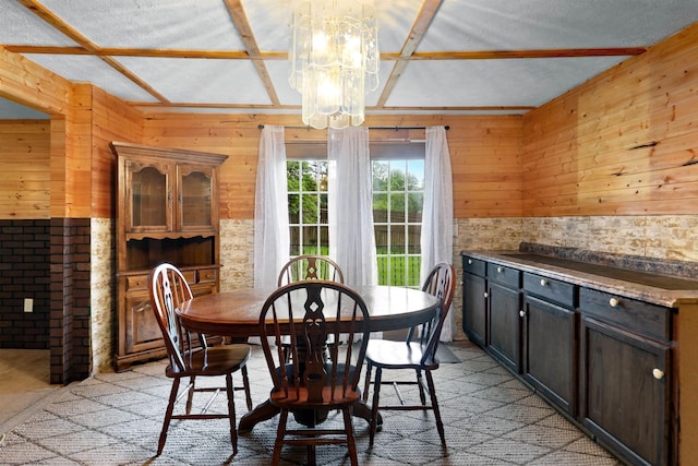 107 Orchard St, Masontown, WV 26542 - dining space with wooden walls, a chandelier, and a textured ceiling