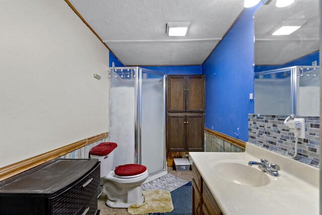 107 Orchard St, Masontown, WV 26542 - full bath featuring toilet, a stall shower, a wainscoted wall, vanity, and a textured ceiling