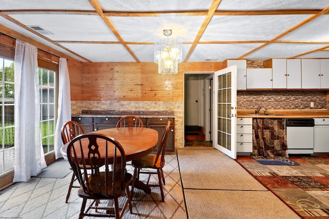 107 Orchard St, Masontown, WV 26542 - dining space with a chandelier, french doors, and wooden walls