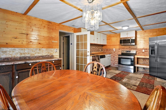107 Orchard St, Masontown, WV 26542 - dining space with a chandelier and wood walls