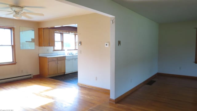 1782 Parsons Rd, Montrose, WV 26283 - kitchen featuring a ceiling fan, wood finished floors, light countertops, and baseboards