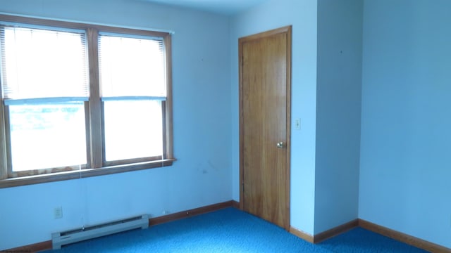 1782 Parsons Rd, Montrose, WV 26283 - unfurnished bedroom featuring baseboard heating, multiple windows, carpet flooring, and baseboards
