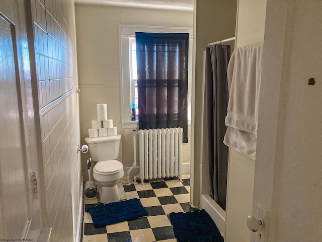 374 Forest Ave Unit 3, Morgantown, WV 26505 - bathroom featuring radiator, tile patterned floors, a stall shower, toilet, and plenty of natural light