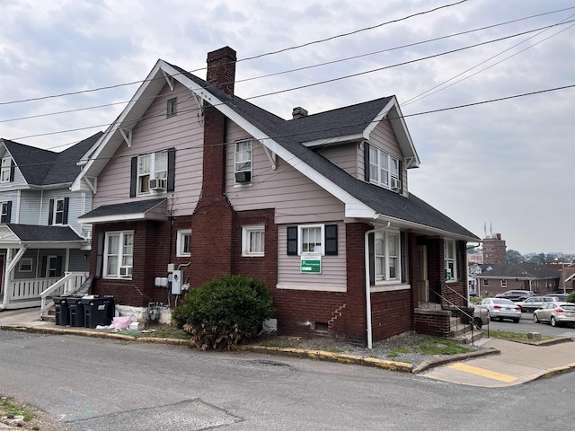 374 Forest Ave Unit 3, Morgantown, WV 26505 - view of side of property with brick siding, a chimney, and cooling unit