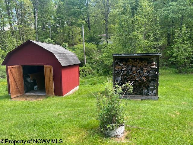 6142 Kanetown Rd, Tunnelton, WV 26444 - view of shed with a wooded view
