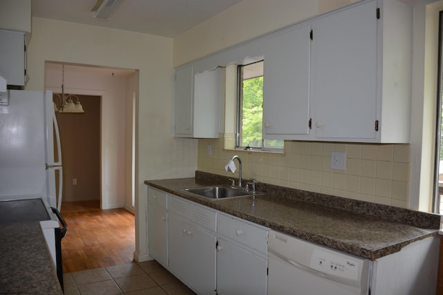 1251 Briercliff Rd, Bridgeport, WV 26330 - kitchen with white appliances, a sink, decorative backsplash, white cabinets, and dark countertops