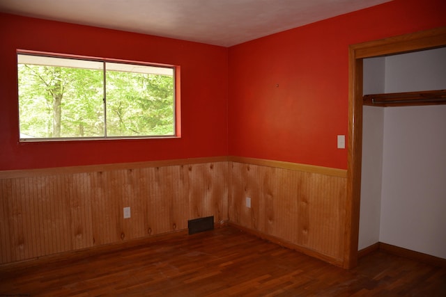1251 Briercliff Rd, Bridgeport, WV 26330 - unfurnished room with wood finished floors, wood walls, and a wainscoted wall