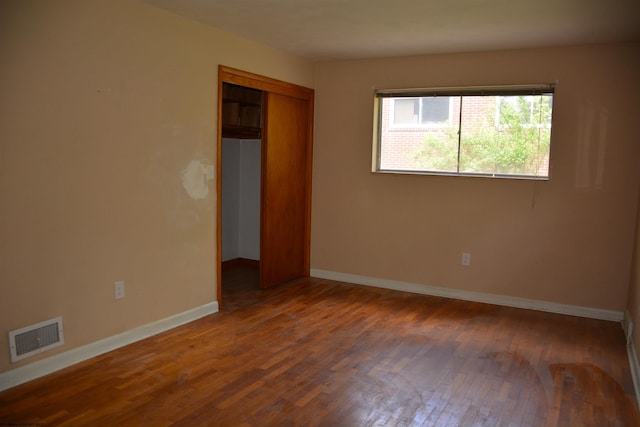 1251 Briercliff Rd, Bridgeport, WV 26330 - unfurnished bedroom with wood finished floors, baseboards, and a closet