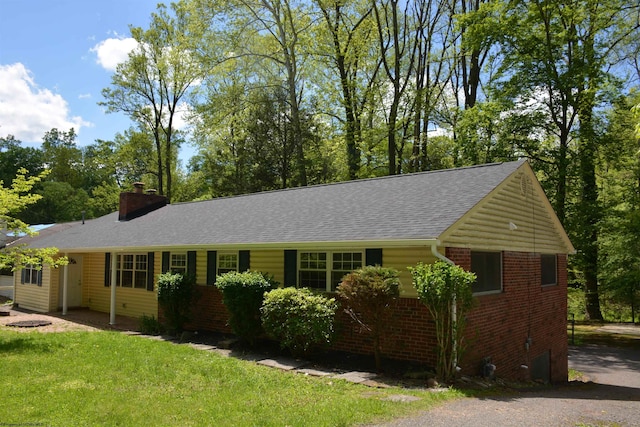1251 Briercliff Rd, Bridgeport, WV 26330 - single story home with brick siding, a chimney, a shingled roof, and a front yard