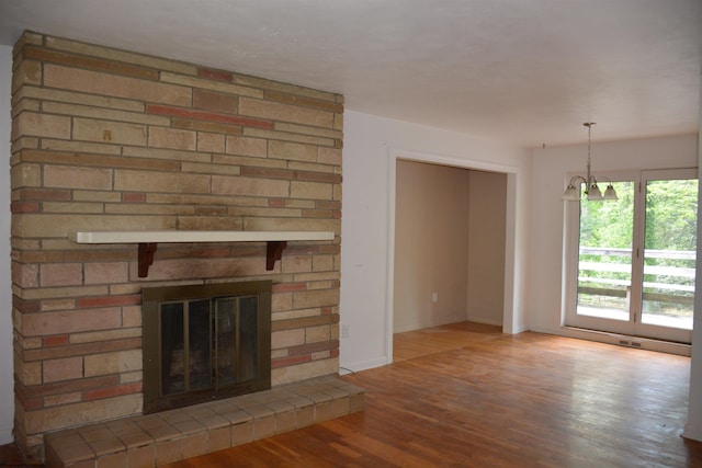 1251 Briercliff Rd, Bridgeport, WV 26330 - unfurnished living room with wood finished floors, a fireplace, and baseboards