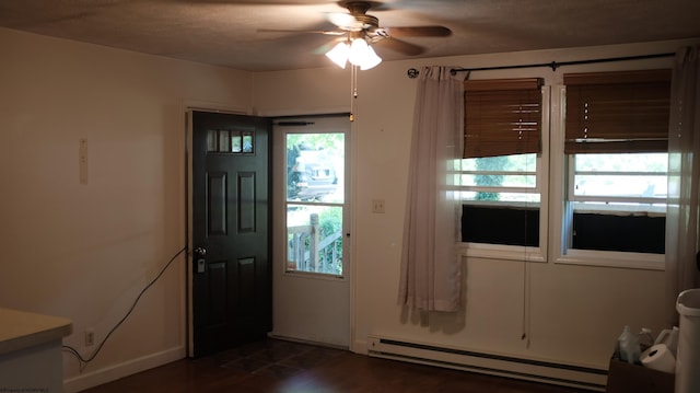 1963 Point Marion Rd, Morgantown, WV 26508 - foyer featuring baseboard heating, ceiling fan, and baseboards