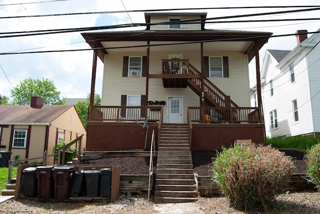 rear view of house with stairway