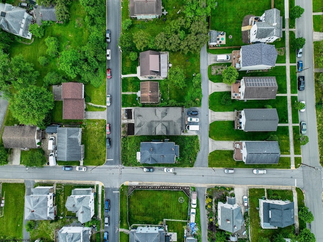 aerial view of property and surrounding area with nearby suburban area