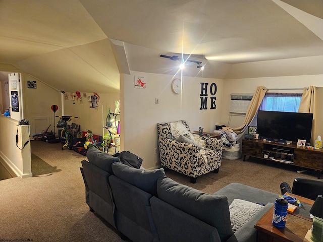 carpeted living area featuring vaulted ceiling