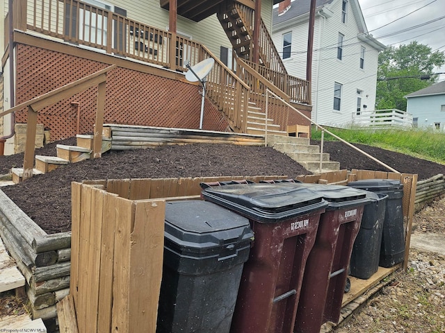 view of yard with stairway and a wooden deck