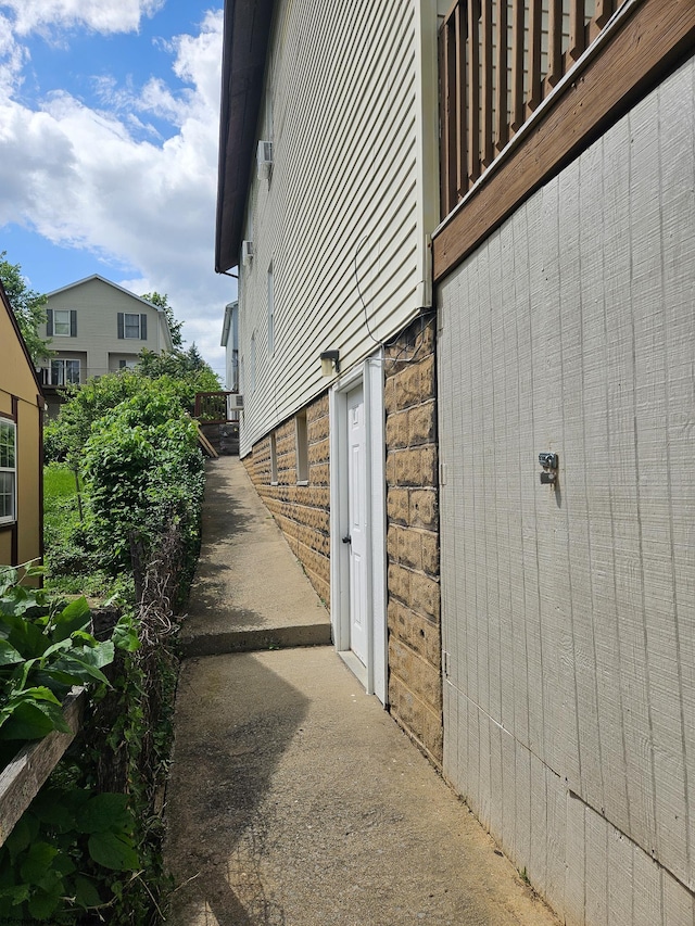 view of side of home with brick siding