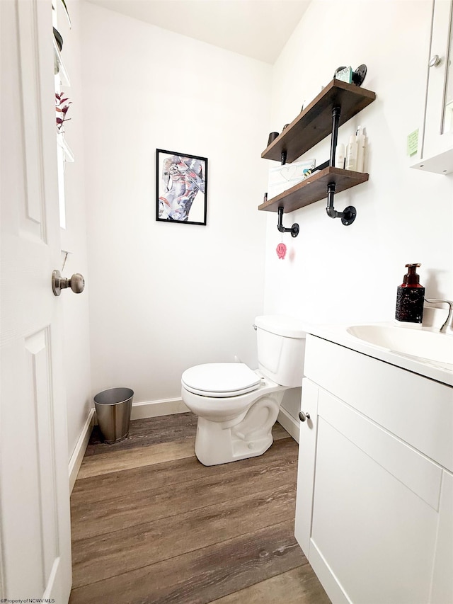 96 Long St, Hambleton, WV 26269 - bathroom with wood finished floors, toilet, vanity, and baseboards