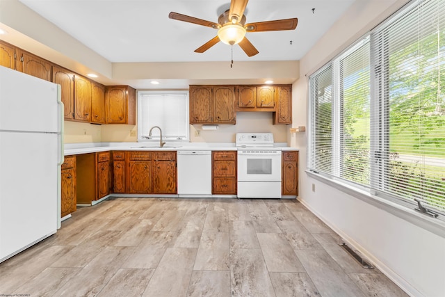 6 Ridge Pl, Morgantown, WV 26505 - kitchen with white appliances, a sink, brown cabinets, light countertops, and a ceiling fan