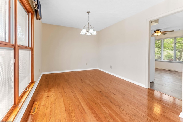 6 Ridge Pl, Morgantown, WV 26505 - unfurnished room featuring a chandelier, light wood finished floors, a ceiling fan, and baseboards