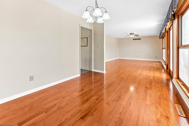 6 Ridge Pl, Morgantown, WV 26505 - spare room featuring a chandelier, a ceiling fan, light wood-type flooring, and baseboards