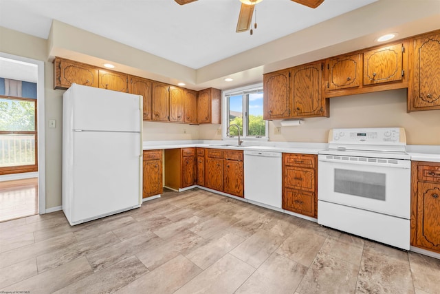 6 Ridge Pl, Morgantown, WV 26505 - kitchen featuring white appliances, brown cabinets, a ceiling fan, light countertops, and a sink