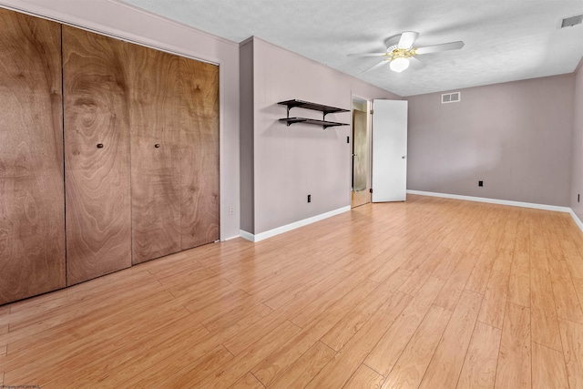 6 Ridge Pl, Morgantown, WV 26505 - unfurnished bedroom with light wood-style floors, baseboards, ceiling fan, and a textured ceiling