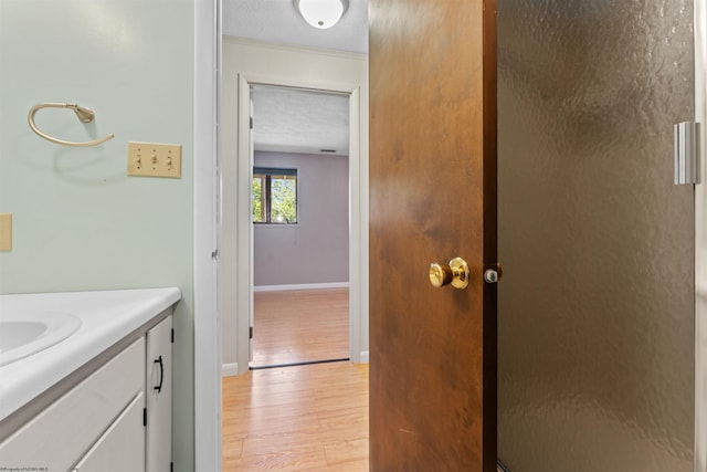 6 Ridge Pl, Morgantown, WV 26505 - bathroom featuring wood finished floors, vanity, baseboards, and a textured ceiling