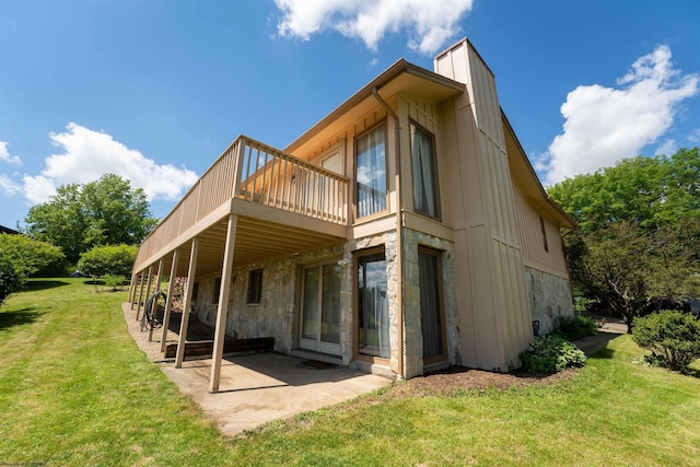 6 Ridge Pl, Morgantown, WV 26505 - rear view of house featuring a lawn, stone siding, a deck, a patio, and a chimney