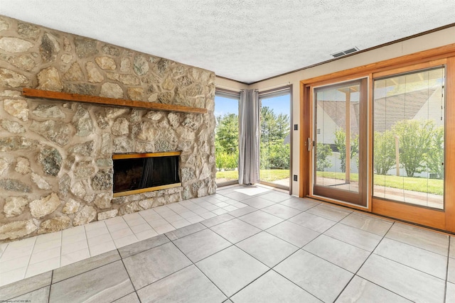 6 Ridge Pl, Morgantown, WV 26505 - unfurnished living room featuring tile patterned flooring, a textured ceiling, and a fireplace