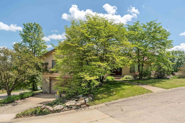 6 Ridge Pl, Morgantown, WV 26505 - view of property hidden behind natural elements with driveway, a front yard, and a garage