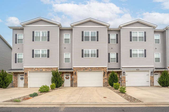 2052 Mountain Ash Ln, Morgantown, WV 26501 - multi unit property with stone siding, concrete driveway, and a garage