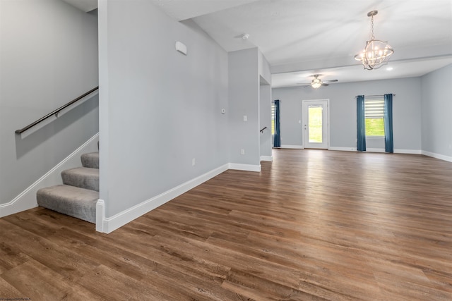 2052 Mountain Ash Ln, Morgantown, WV 26501 - unfurnished living room with wood finished floors, a ceiling fan, a chandelier, stairway, and baseboards