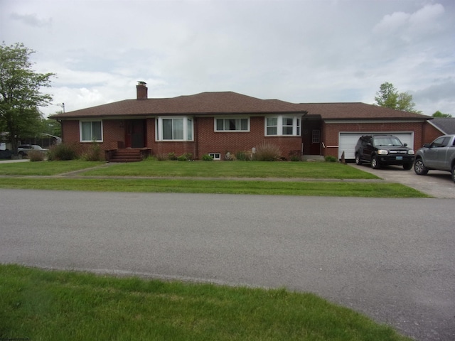 201 Findley St, Elkins, WV 26241 - ranch-style home featuring a garage, a chimney, brick siding, a front lawn, and driveway